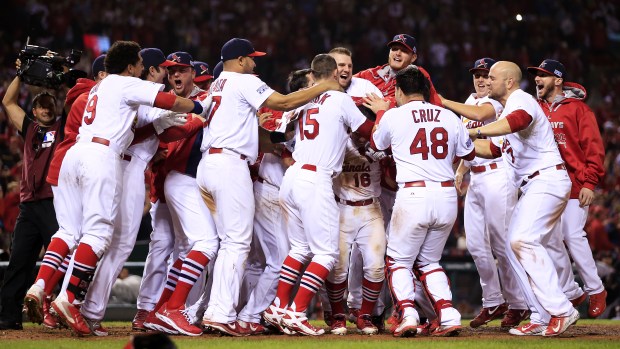 ST LOUIS, MO - OCTOBER 12:  Kolten Wong #16 of the St. Louis Cardinals celebrates his solo home run in the ninth inning to give the St. Louis Cardinals the 5 to 4 win over the San Francisco Giants with teammates during Game Two of the National League Championship Series at Busch Stadium on October 12, 2014 in St Louis, Missouri.  (Photo by Jamie Squire/Getty Images)