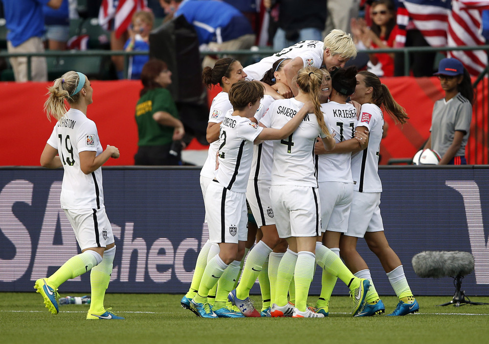 Jun 22, 2015; Edmonton, Alberta, CAN; United States forward Alex Morgan (13) celebrates a her goal with teammates during the second half against the Colombia in the round of sixteen in the FIFA 2015 women's World Cup soccer tournament at Commonwealth Stadium. Mandatory Credit: Michael Chow-USA TODAY Sports  ORG XMIT: USATSI-227746 ORIG FILE ID:  20150621_pjc_usa_433.JPG