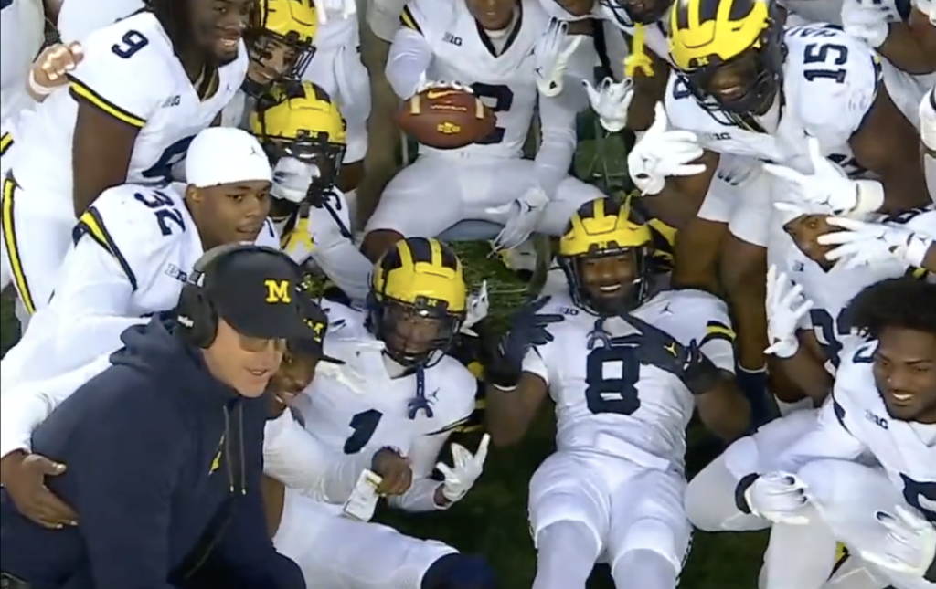 Jim Harbaugh joins the celebration.