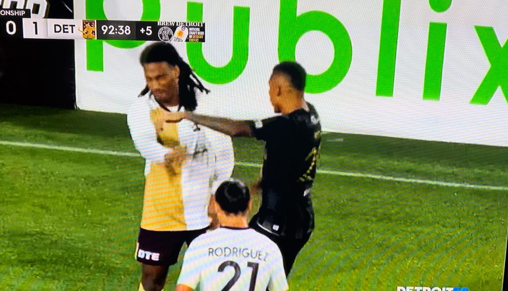 Detroit City FC defender Devon Amoo-Mensah gets slapped by Stefano Pinho.