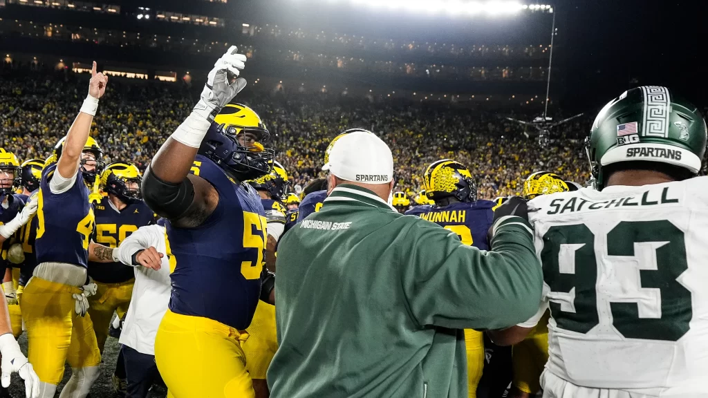 Michigan State and Michigan fight at the end of the game.