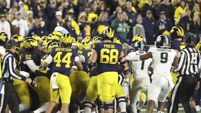 Michigan and Michigan State fight.